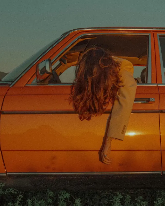 Woman Leaning Out of Vintage Car, retro, photographic, warm