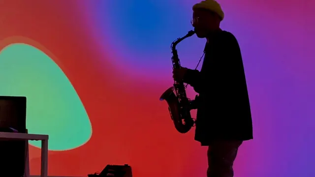Saxophonist against vibrant gradient, gradient-heavy, abstract, vibrant