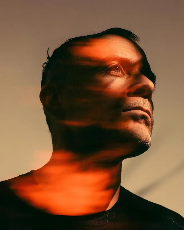 Dramatic Portrait with Orange Light Overlay, photographic, abstract, dark