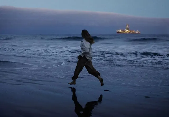 Woman Running on Beach at Dusk, photographic, organic, muted
