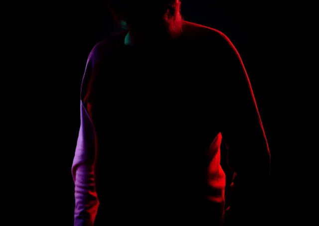 Silhouette with Red Rim Lighting, dark-mode, photographic, dark