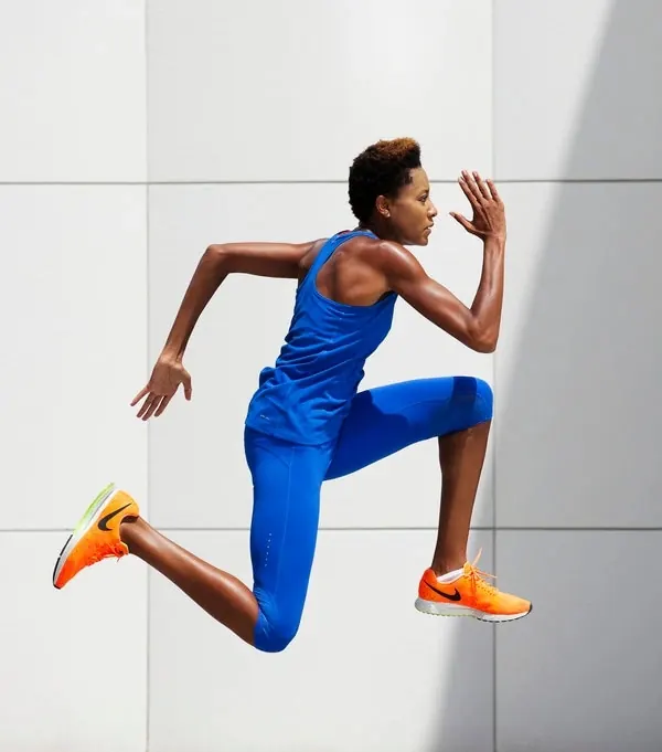 Athlete in Blue Performance Wear, minimal, photographic, vibrant