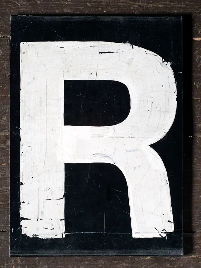 Large White Letter R on Black Background, minimal, brutalist, high-contrast