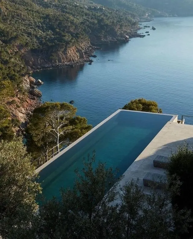 Infinity Pool Overlooking the Coast, photographic, luxury, cool