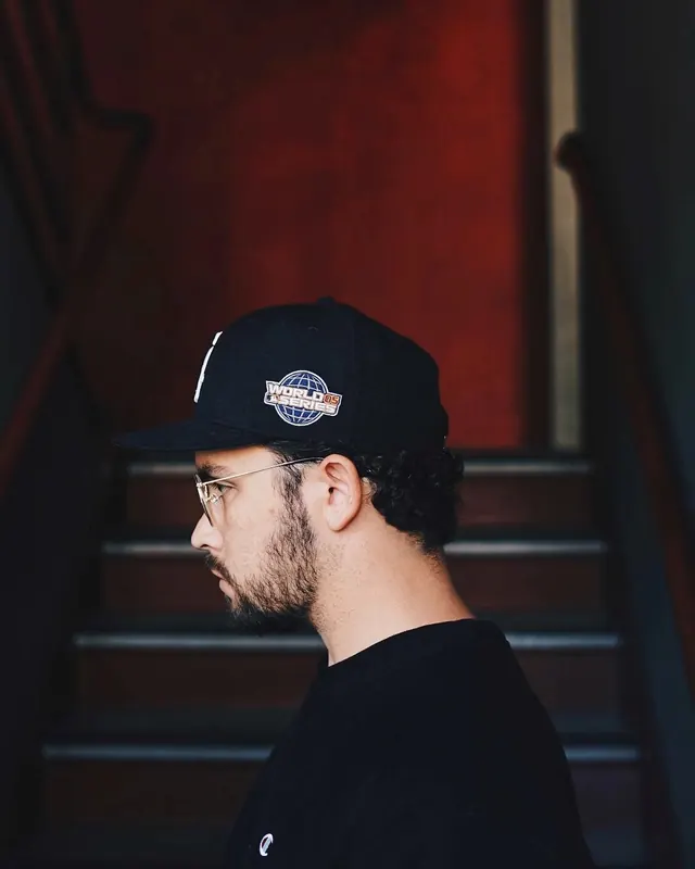 Man in Black Beanie with Logo, photographic, dark