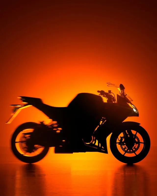 Silhouette of a Sportbike in Orange Glow, minimal, photographic, vibrant