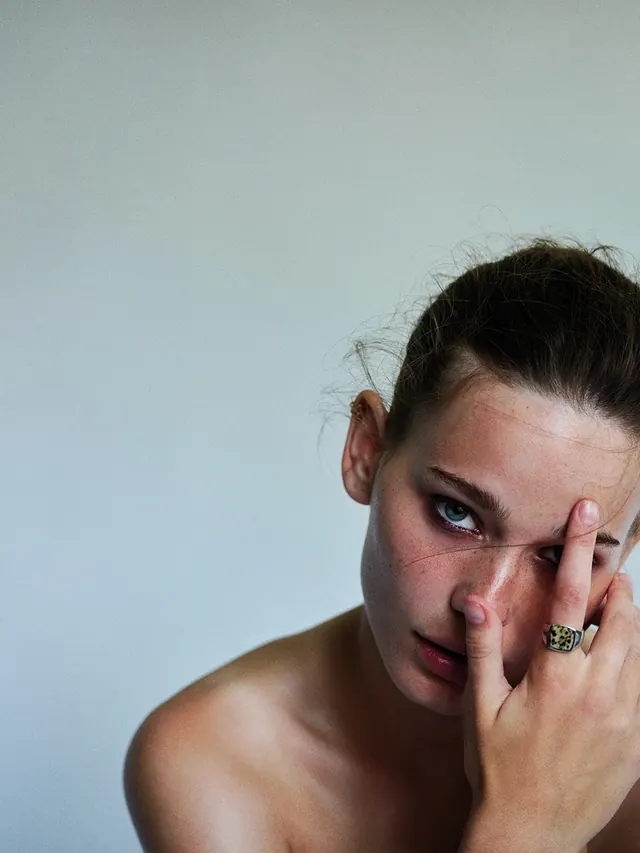 Portrait of a Woman with Finger on Lips, photographic, minimal, light