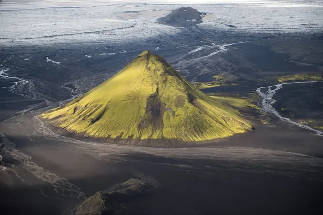 Yellow Volcanic Cone in Snowy Landscape, photographic, organic, high-contrast