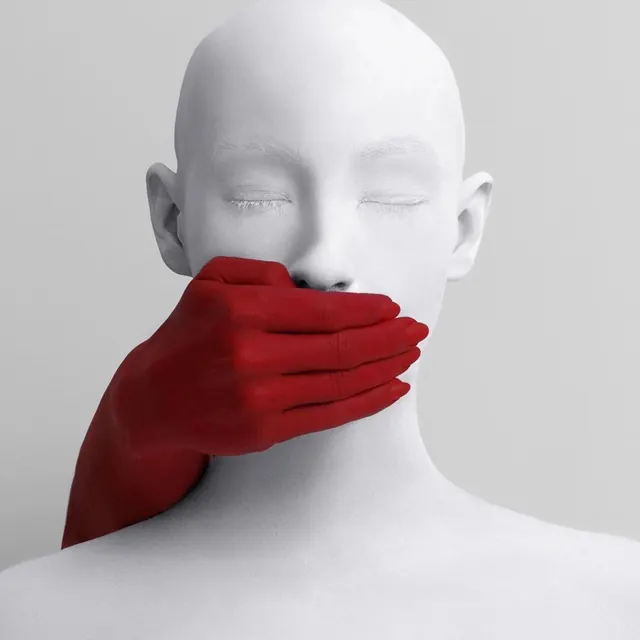 Red Hand Over Mouth Sculpture, minimal, abstract, high-contrast