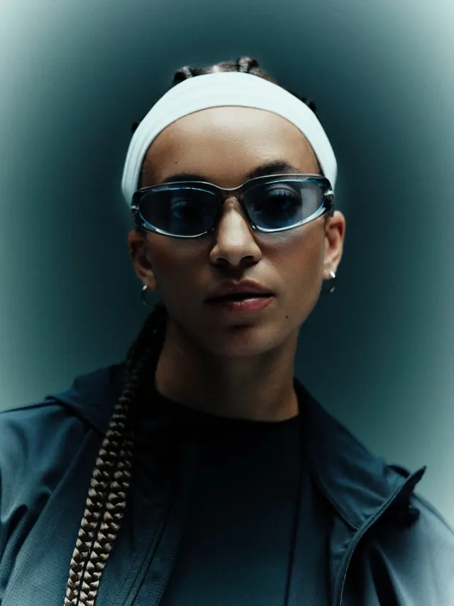 Portrait of a Woman in Sportswear, photographic, minimal, dark