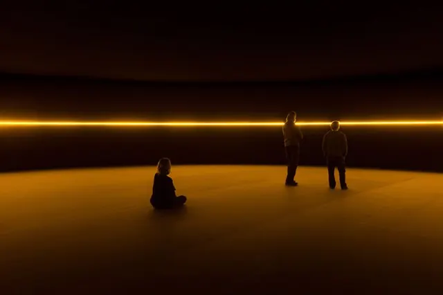 Silhouetted Figures in Golden Void, minimal, photographic, warm
