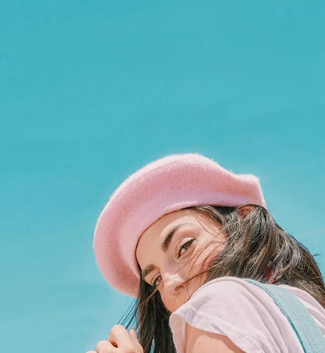 Portrait of a Woman in a Pink Beanie, playful, y2k, vibrant