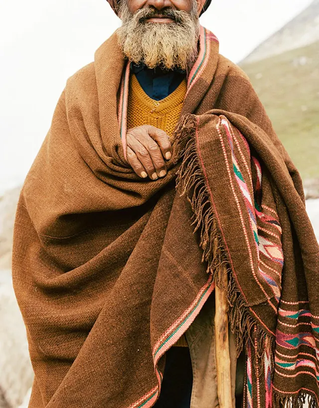 Man in Traditional Andean Poncho, photographic, organic, earthy