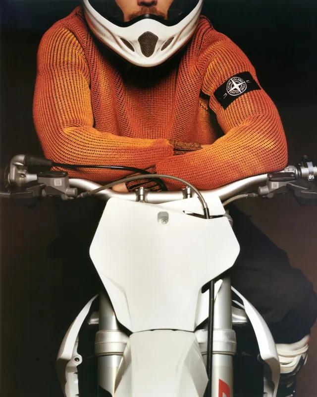 Motorcycle Rider in Orange Gear, photographic, vibrant