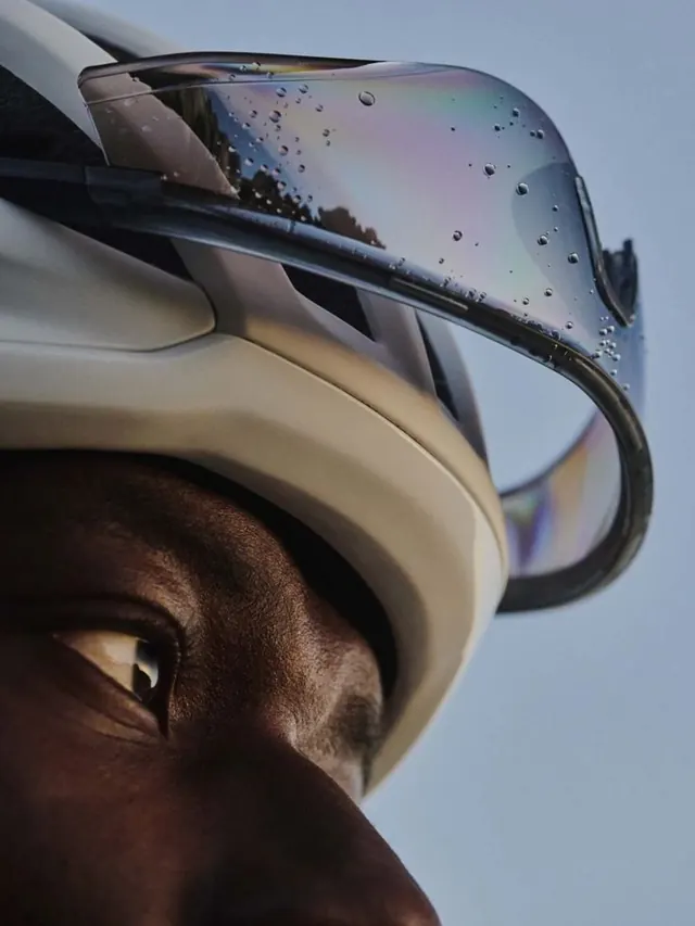Close-up of a Person Wearing a White Helmet with Iridescent Visor, photographic, luxury, high-contrast