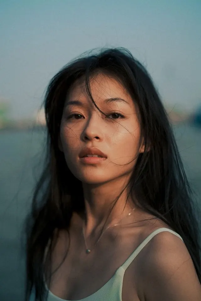 Portrait of a Woman in a Green Top, photographic, organic, muted