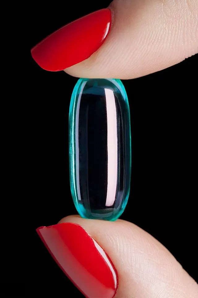 Red Nail Polish and Blue Capsule, minimal, photographic, vibrant