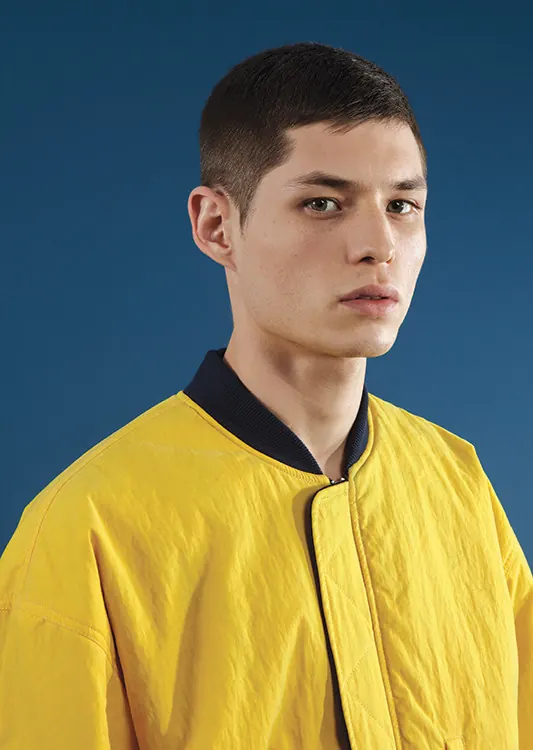 Male Model in Yellow Jacket, minimal, photographic, vibrant
