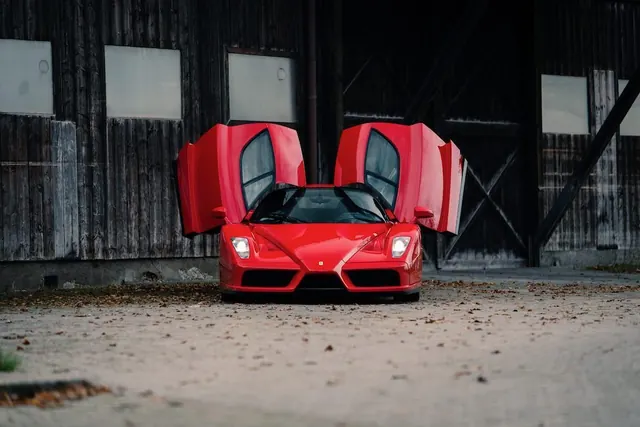 Red Sports Car in Garage, photographic, luxury, vibrant