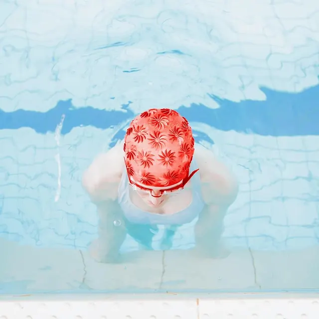 Swimmer in Pool with Patterned Cap, photographic, organic, vibrant