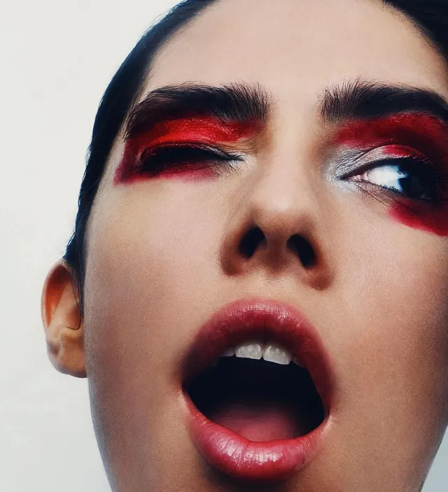 Close-up Portrait with Red Eye Makeup, photographic, maximalist, high-contrast