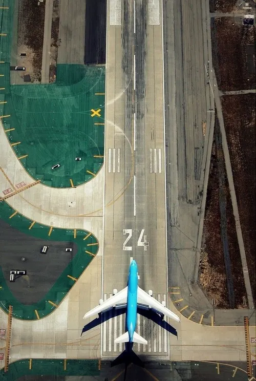 Aerial View of Airplane on Runway, photographic, technical, high-contrast
