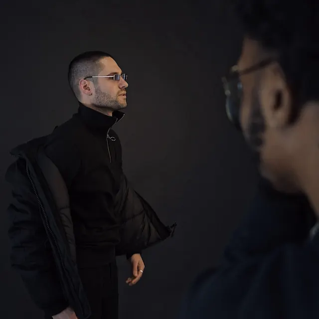 Portrait of a Man in Glasses, minimal, dark-mode, dark