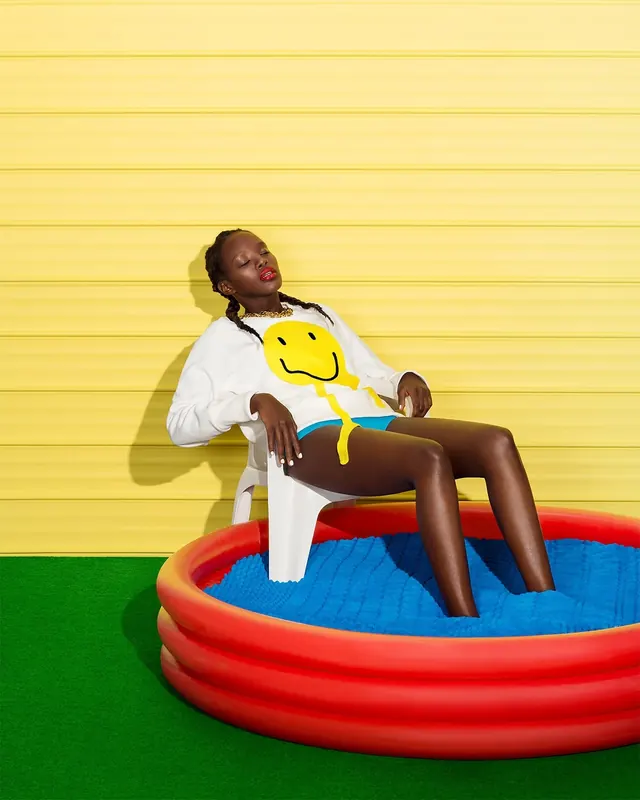 Man in Inflatable Pool, photographic, playful, vibrant