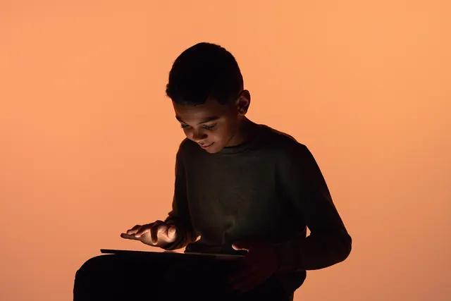 Student Studying with Laptop, photographic, minimal, warm