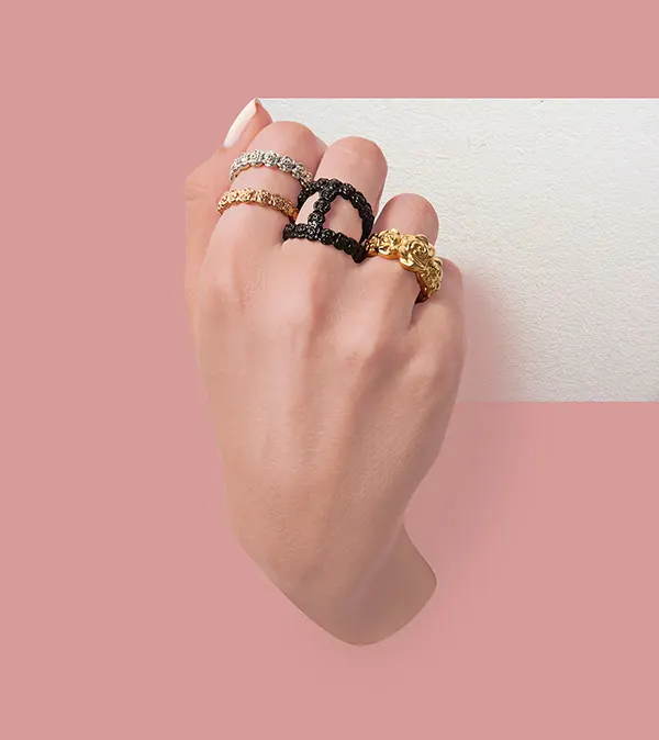 Hand with Gold and Black Rings, minimal, luxury, pastel