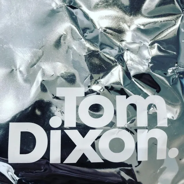 Tom Dixon Wordmark on Crinkled Foil, minimal, luxury, high-contrast