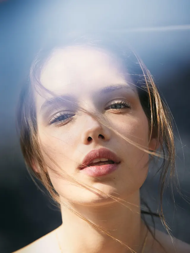 Close-up Portrait of a Woman, photographic, luxury, warm