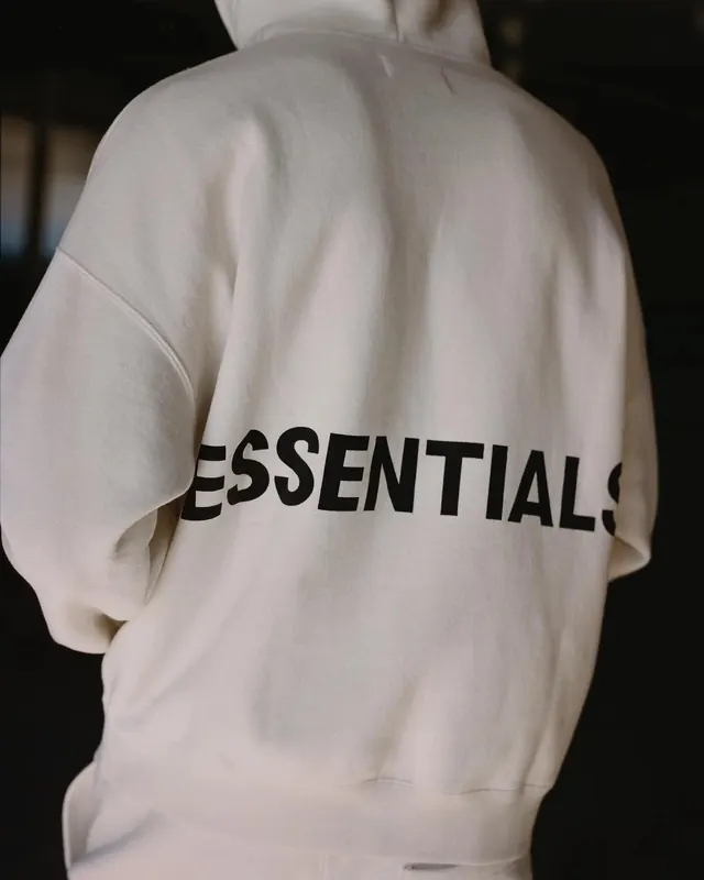 Essential Wordmark on Hoodie Mockup, minimal, photographic, monochrome
