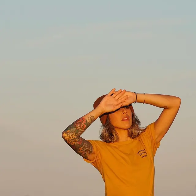 Portrait of a Person in a Yellow Shirt, photographic, minimal, warm