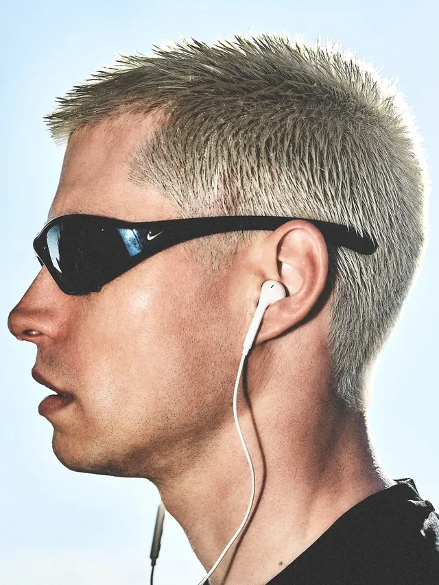 Man with VR Headset and Earbuds, photographic, minimal, high-contrast