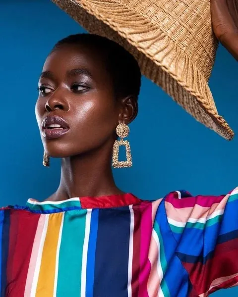 Fashion Portrait with Straw Hat, photographic, luxury, vibrant