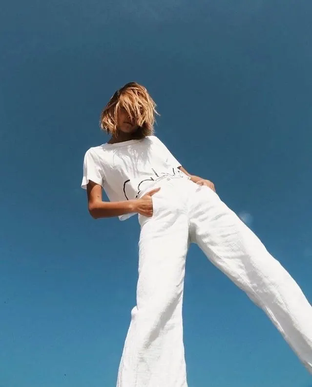 Woman in White Outfit Against Blue Sky, minimal, photographic, light