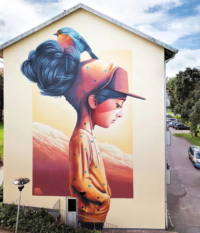 Street Art Mural of a Woman in a Red Hat, illustrated, organic, vibrant
