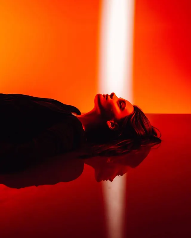 Reflective Portrait in Red, photographic, minimal, vibrant