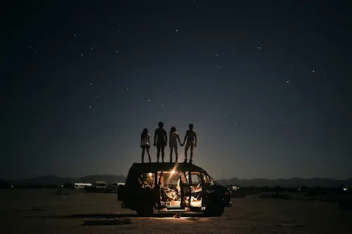 Silhouetted Figures on a Vehicle at Night, photographic, dark-mode, dark