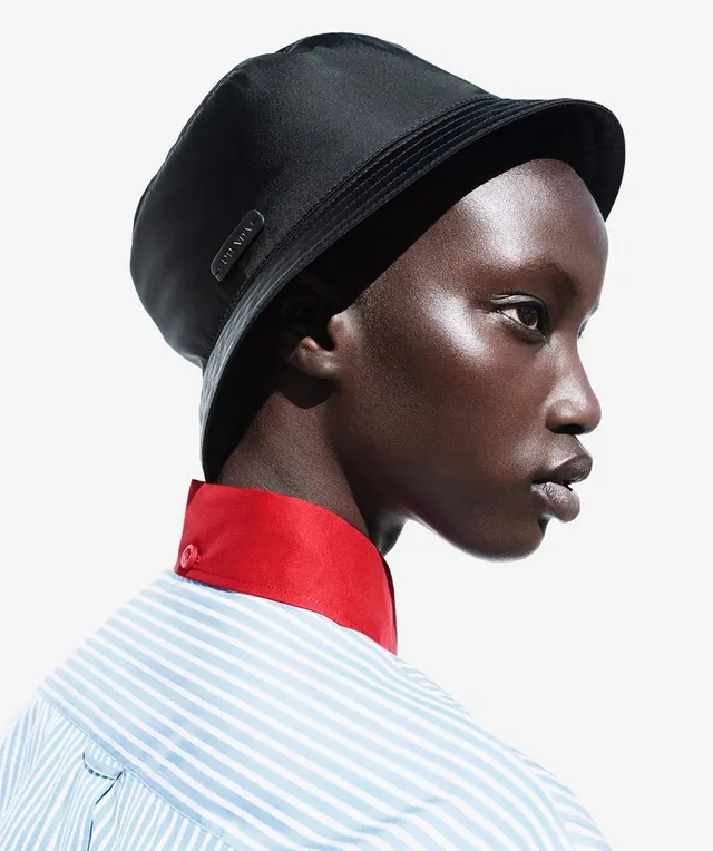 Fashion Portrait with Bucket Hat, minimal, photographic, high-contrast
