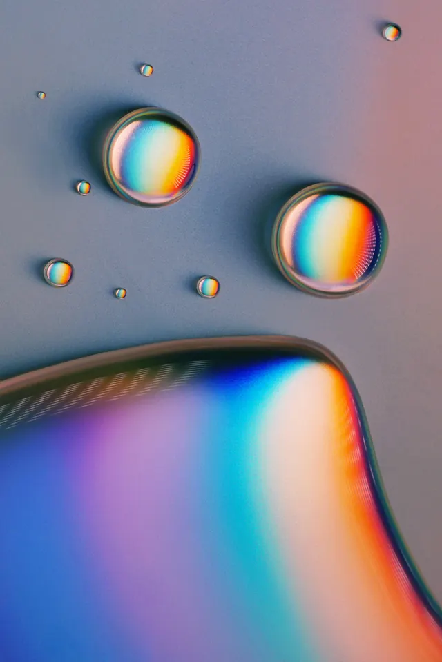 Iridescent Liquid Droplets, glassmorphism, gradient-heavy, vibrant