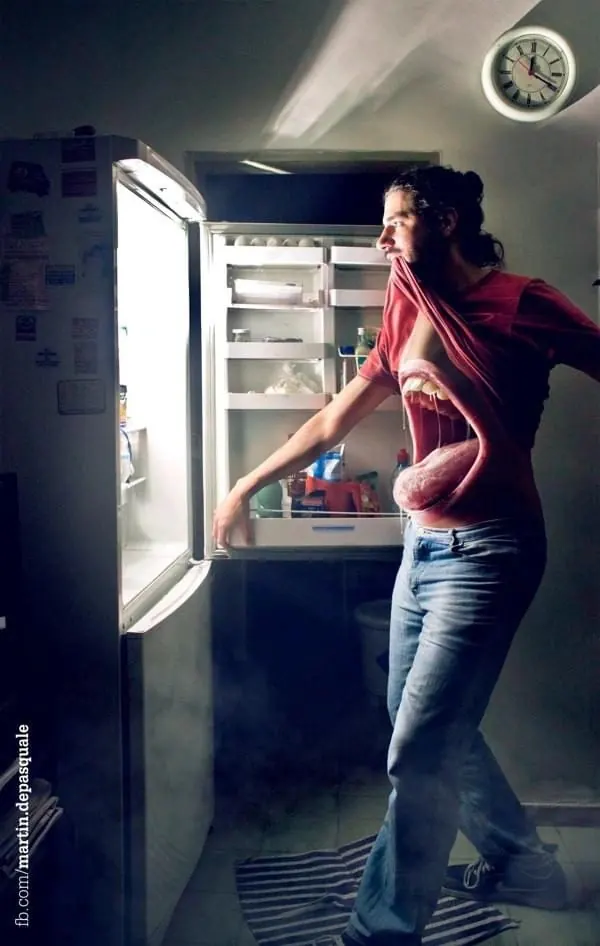 Woman Reaching into Refrigerator, photographic, dark