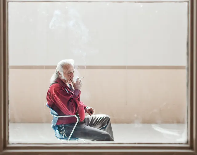 Elderly Man Smoking in Window, minimal, photographic, muted