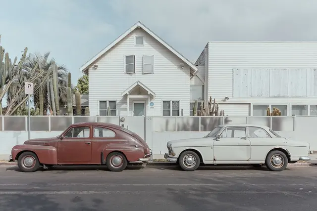 Vintage Cars in Front of a Modern House, photographic, minimal, light