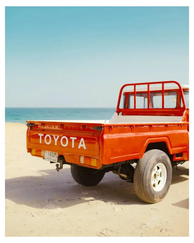 Red Toyota Pickup Truck on Beach, retro, photographic, vibrant