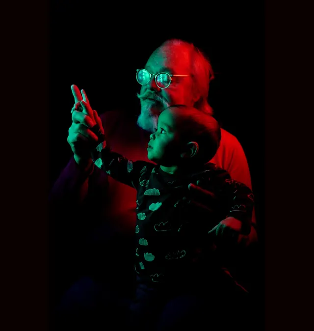 Man with Robot in Neon Lighting, photographic, dark-mode, dark