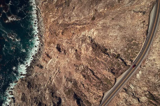 Aerial Coastal Road and Cliffside, photographic, organic, earthy
