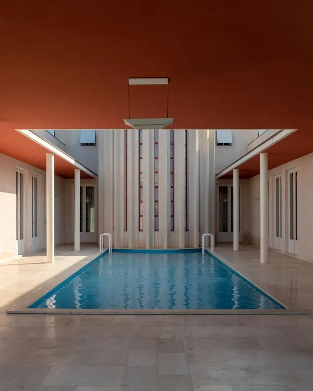 Modernist Indoor Pool with Terracotta Ceiling, minimal, geometric, warm