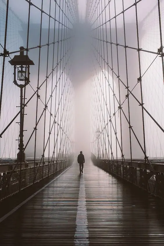 Person Walking on Suspension Bridge, minimal, photographic, monochrome